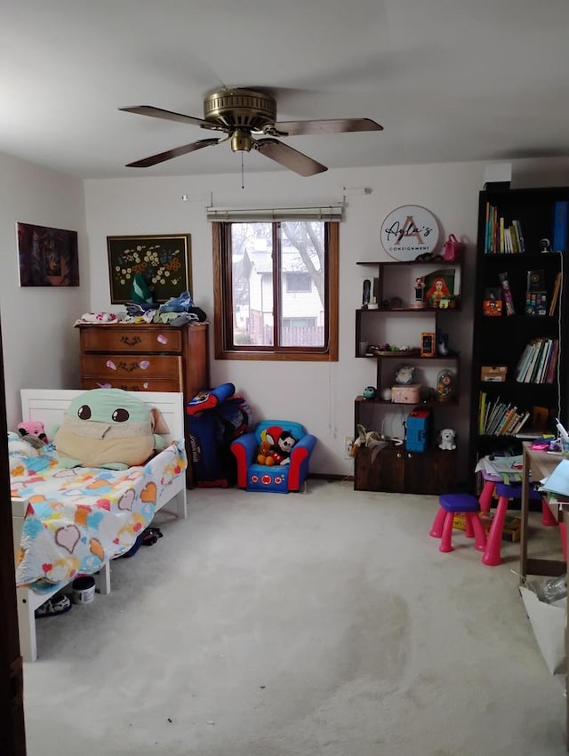 carpeted bedroom featuring a ceiling fan