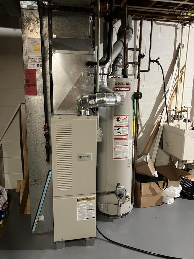 utilities featuring water heater and a sink