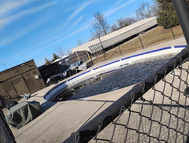community pool featuring fence