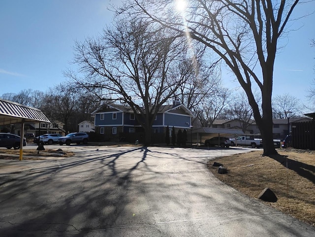 view of asphalt road featuring a residential view