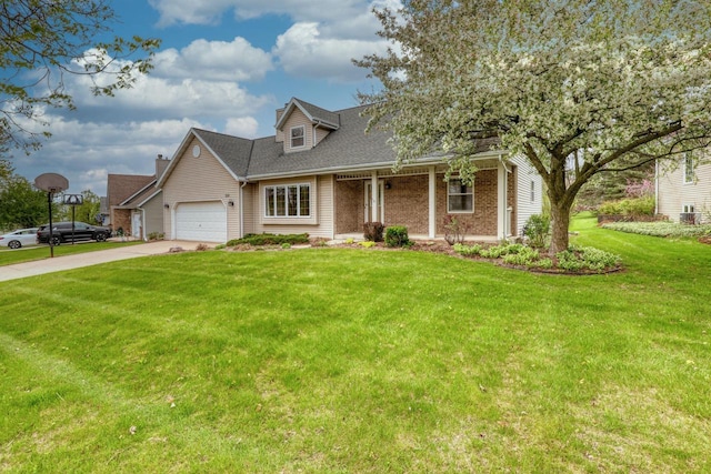 view of front of property featuring a front lawn, driveway, an attached garage, brick siding, and roof with shingles