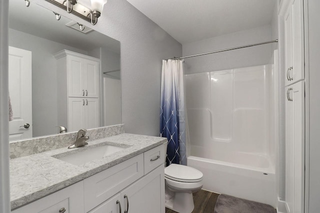 2130 90th St, Sturtevant, WI 53177 - full bath featuring toilet, shower / bath combo, vanity, and wood finished floors