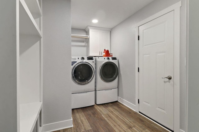 2130 90th St, Sturtevant, WI 53177 - laundry area with cabinet space, washer and dryer, dark wood-style flooring, and baseboards