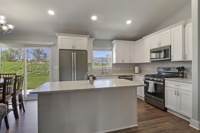 2130 90th St, Sturtevant, WI 53177 - kitchen featuring stainless steel appliances, a center island, a sink, white cabinets, and recessed lighting
