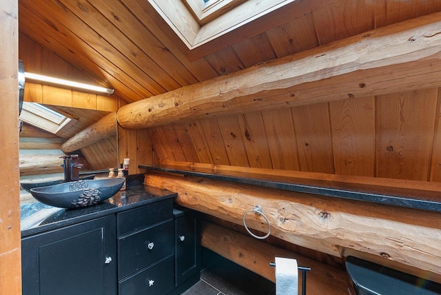 644 County Highway K, Hartford, WI 53027 - bar area featuring a skylight, a sink, and rustic walls