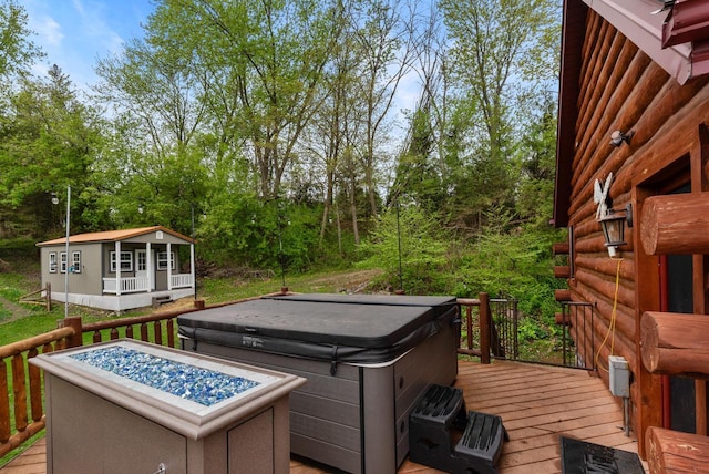 644 County Highway K, Hartford, WI 53027 - wooden deck featuring a hot tub and an outdoor structure