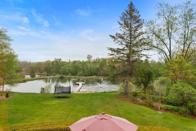 644 County Highway K, Hartford, WI 53027 - view of grassy yard featuring a water view, a forest view, and a trampoline