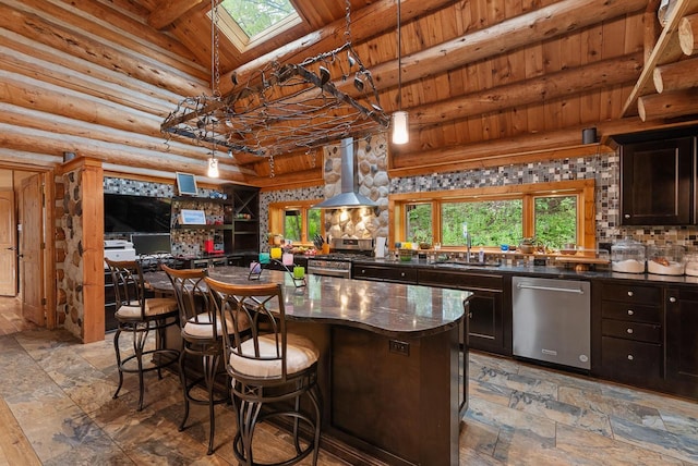 644 County Highway K, Hartford, WI 53027 - kitchen featuring stainless steel appliances, wall chimney exhaust hood, a sink, wood ceiling, and a breakfast bar