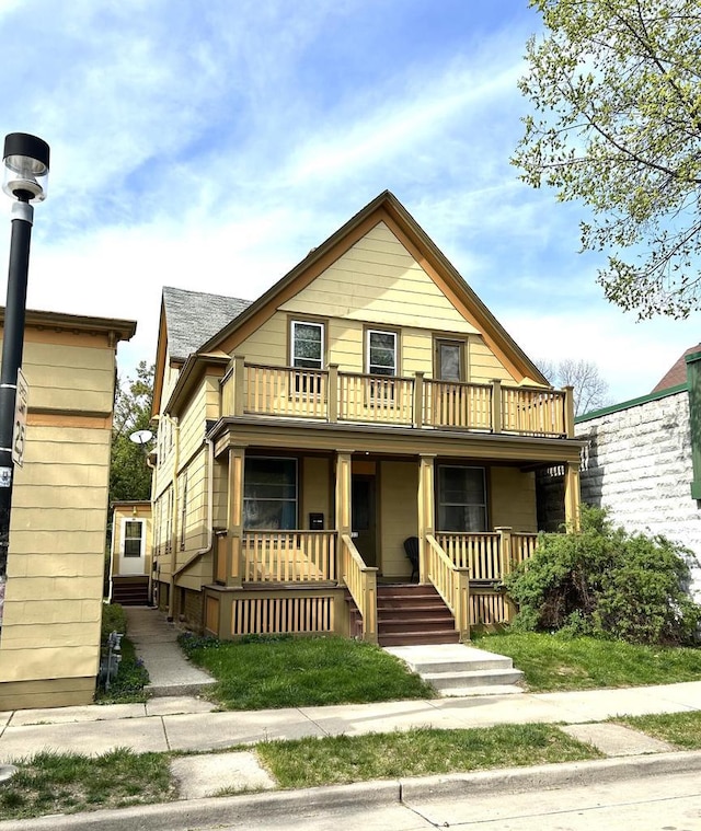 918 E Center St Unit 920, 922, Milwaukee, WI 53212 - view of front of property featuring a porch and a balcony