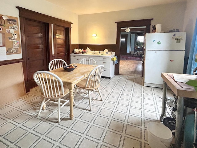 918 E Center St Unit 920, 922, Milwaukee, WI 53212 - dining area featuring light floors and a wainscoted wall
