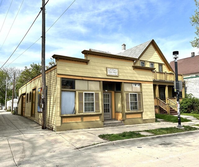 918 E Center St Unit 920, 922, Milwaukee, WI 53212 - view of front of property featuring a balcony and a chimney