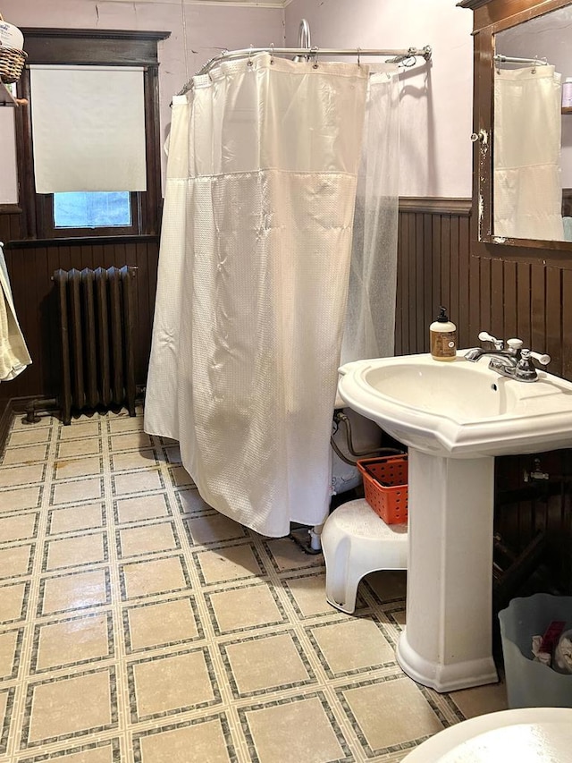 918 E Center St Unit 920, 922, Milwaukee, WI 53212 - full bath featuring radiator heating unit, a wainscoted wall, tile patterned floors, wooden walls, and curtained shower