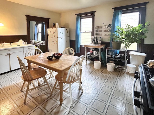 918 E Center St Unit 920, 922, Milwaukee, WI 53212 - dining space featuring light flooring and wainscoting