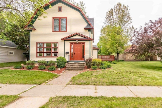 330 1st St, Port Edwards, WI 54469 - colonial inspired home featuring a gambrel roof and a front yard