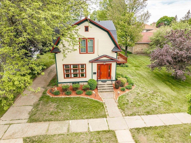 330 1st St, Port Edwards, WI 54469 - colonial inspired home featuring a gambrel roof and a front lawn