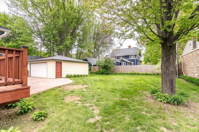 330 1st St, Port Edwards, WI 54469 - view of yard featuring an outdoor structure, a detached garage, and a wooden deck