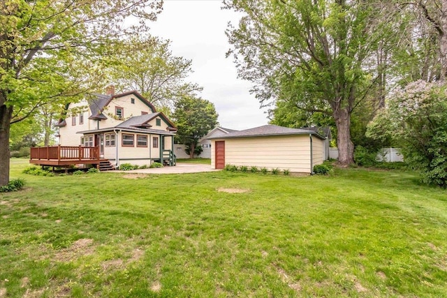 330 1st St, Port Edwards, WI 54469 - view of grassy yard with a wooden deck and an outdoor structure