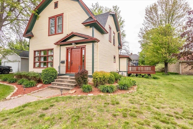 330 1st St, Port Edwards, WI 54469 - dutch colonial featuring a front yard, a gambrel roof, and a wooden deck