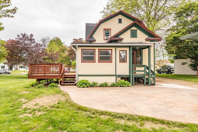 330 1st St, Port Edwards, WI 54469 - rear view of property featuring a yard, a deck, and a gambrel roof