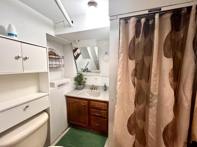 bathroom with vanity, toilet, and a shower with shower curtain