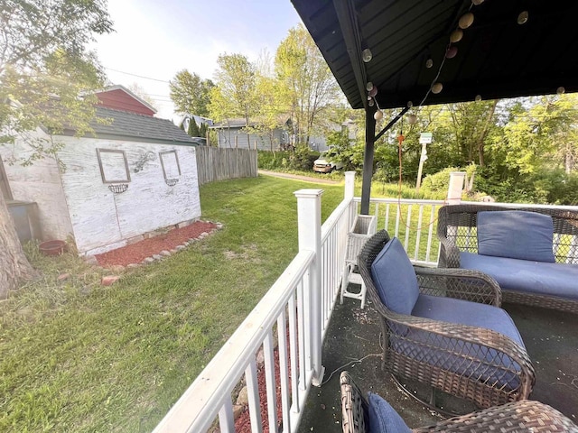 wooden deck featuring a yard
