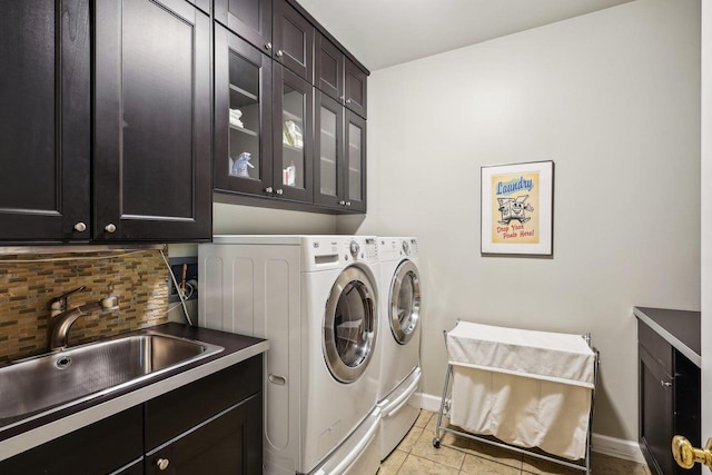 W8849 Deer Run Trl, Cambridge, WI 53523 - laundry area with cabinet space, washing machine and dryer, baseboards, and light tile patterned flooring