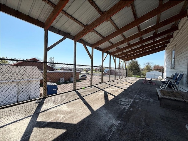 111 Arlington Ave Unit 1-12, Cameron, WI 54822 - view of patio with a carport and fence