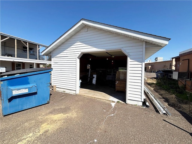 111 Arlington Ave Unit 1-12, Cameron, WI 54822 - detached garage featuring asphalt driveway