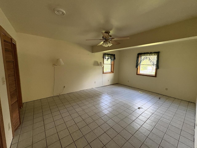 13010 W Honey Ln, New Berlin, WI 53151 - spare room featuring light tile patterned floors and ceiling fan