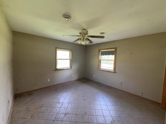 13010 W Honey Ln, New Berlin, WI 53151 - empty room with a ceiling fan and baseboards