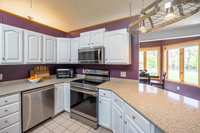 1502 Marquardt Rd, Wausau, WI 54403 - kitchen featuring stainless steel appliances, white cabinets, and light tile patterned floors
