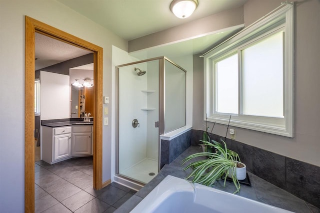 1502 Marquardt Rd, Wausau, WI 54403 - bathroom with a stall shower, vanity, tile patterned floors, and a bathtub
