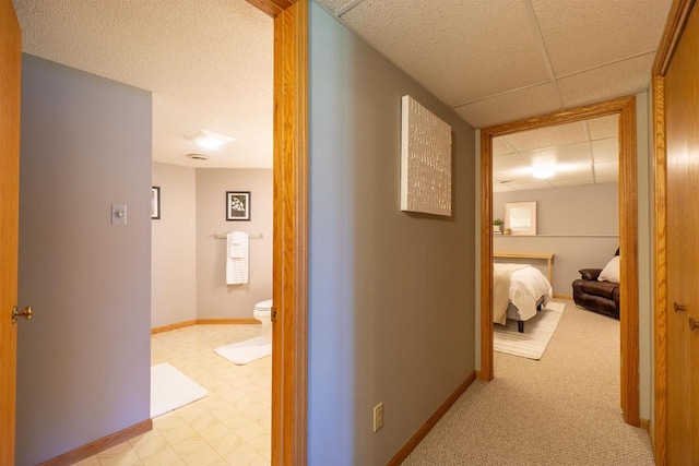 1502 Marquardt Rd, Wausau, WI 54403 - corridor featuring a drop ceiling and baseboards