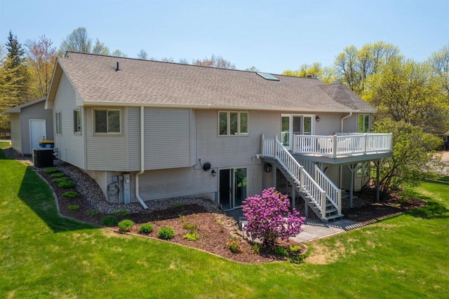 1502 Marquardt Rd, Wausau, WI 54403 - back of house with a wooden deck, stairs, a yard, cooling unit, and a shingled roof
