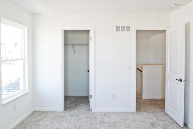 4004 Banbury St, Windsor, WI 53598 - unfurnished bedroom with multiple windows, carpet, and a closet