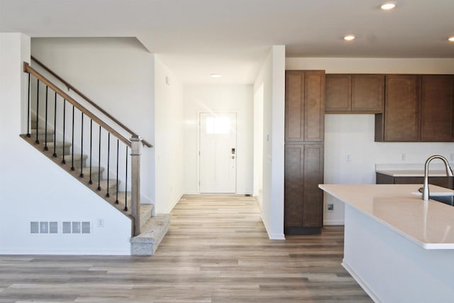 4004 Banbury St, Windsor, WI 53598 - kitchen featuring light wood finished floors, light countertops, recessed lighting, a sink, and baseboards