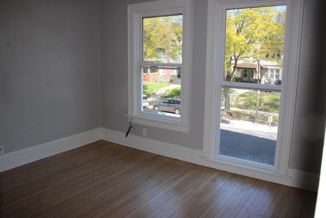 2909 N Farwell Ave, Milwaukee, WI 53211 - doorway featuring wood-type flooring, healthy amount of natural light, and baseboards