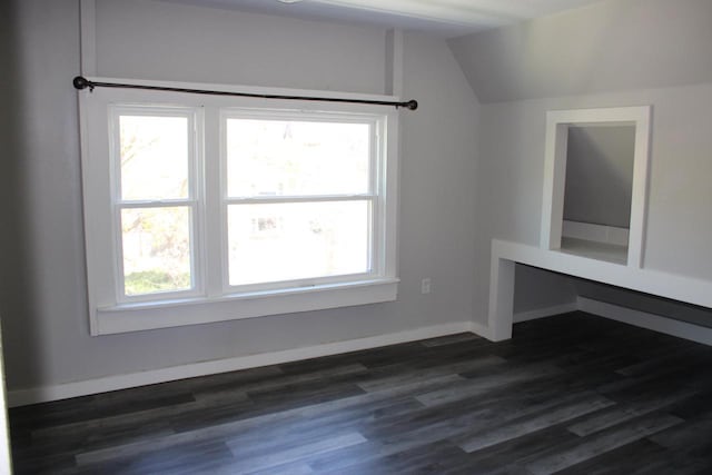 2909 N Farwell Ave, Milwaukee, WI 53211 - bonus room with vaulted ceiling, dark wood-style floors, and baseboards