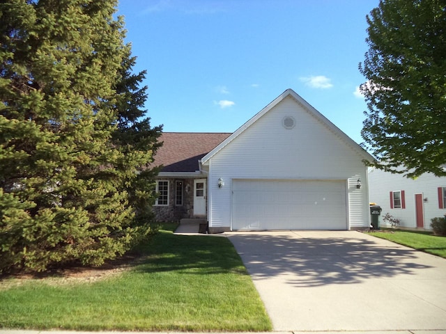 ranch-style home featuring a garage, driveway, a front yard, and roof with shingles