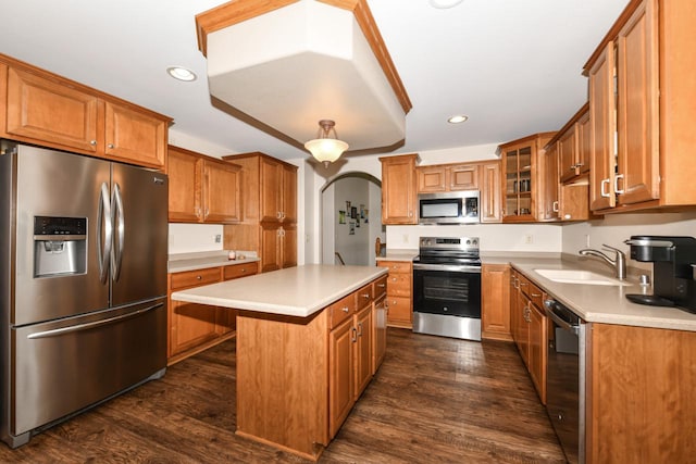 6454 Heritage Ave, Mount Pleasant, WI 53406 - kitchen featuring stainless steel appliances, a sink, brown cabinetry, a kitchen island, and recessed lighting