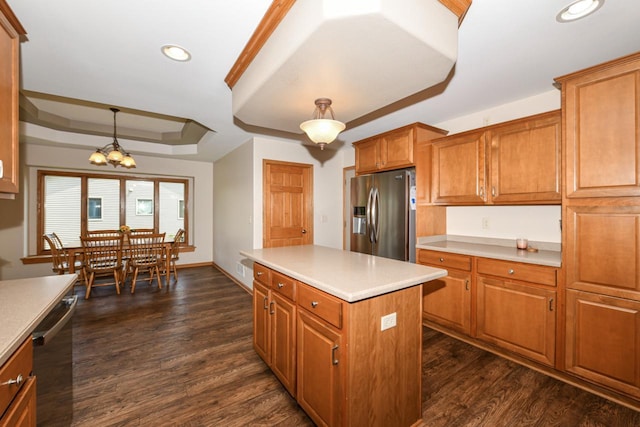 6454 Heritage Ave, Mount Pleasant, WI 53406 - kitchen featuring appliances with stainless steel finishes, a raised ceiling, recessed lighting, brown cabinets, and a chandelier