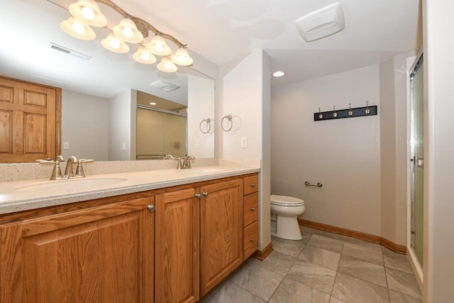 6454 Heritage Ave, Mount Pleasant, WI 53406 - bathroom with baseboards, a stall shower, double vanity, and toilet