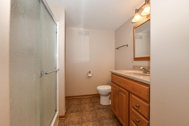 6454 Heritage Ave, Mount Pleasant, WI 53406 - bathroom with vanity, a shower stall, toilet, and baseboards