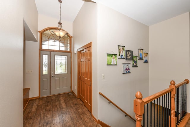 6454 Heritage Ave, Mount Pleasant, WI 53406 - foyer entrance featuring dark wood-type flooring, baseboards, and a towering ceiling