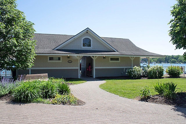 91 Oakwood St, Williams Bay, WI 53191 - view of front of house with dirt driveway and a shingled roof