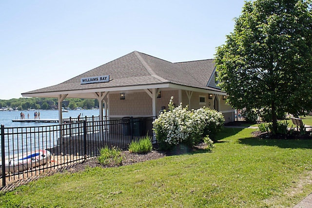 91 Oakwood St, Williams Bay, WI 53191 - view of property exterior with a shingled roof and a water view