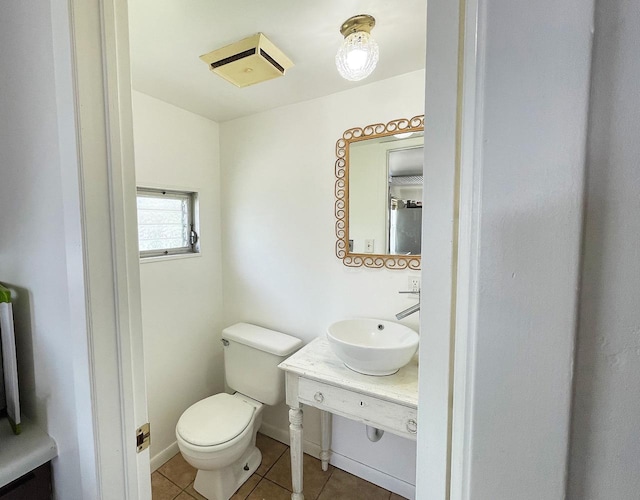 91 Oakwood St, Williams Bay, WI 53191 - half bath featuring tile patterned floors, toilet, vanity, and baseboards