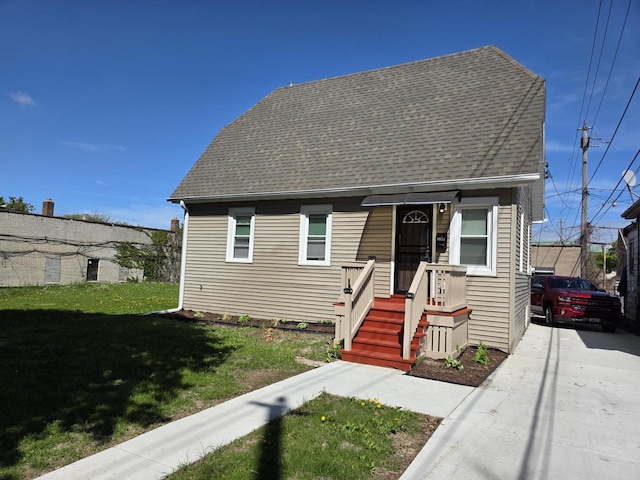 2668 N 54th St, Milwaukee, WI 53210 - view of front of home with a front yard and roof with shingles