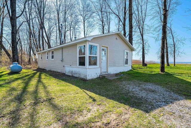229 Bay Rd, Peshtigo, WI 54147 - view of side of home with a yard