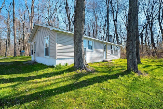 229 Bay Rd, Peshtigo, WI 54147 - view of side of property with a yard and a chimney